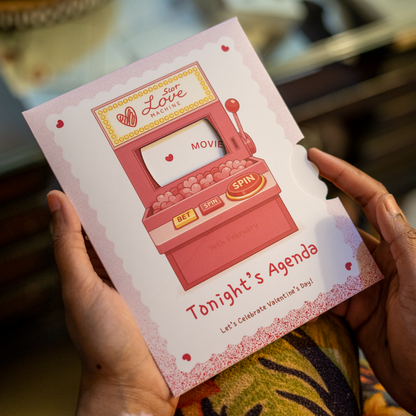 Card with a love machine design held by a person