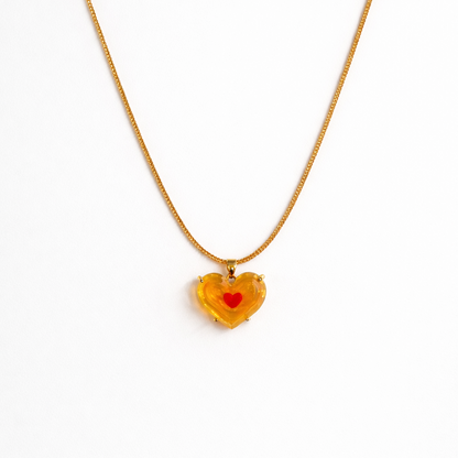 amber heart pendant necklace with red heart center