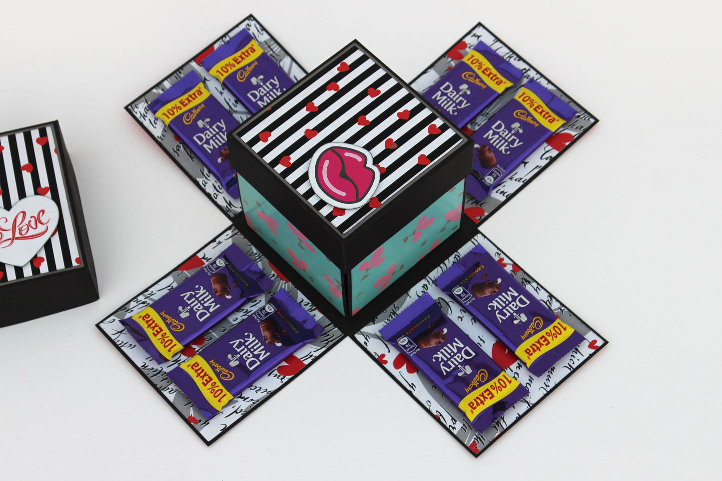 5 Star chocolate explosion box open with Cadbury Dairy Milk chocolates on four panels