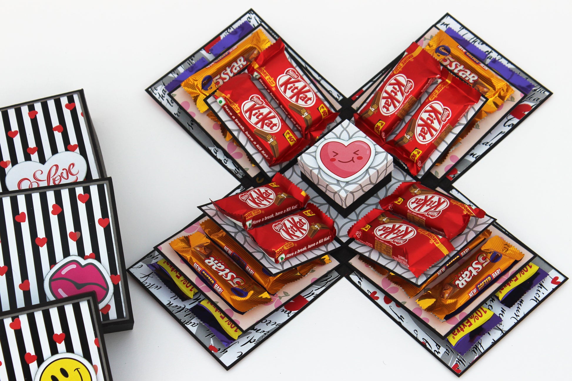Chocolate explosion box with KitKat and 5 Star chocolates arranged inside layered panels