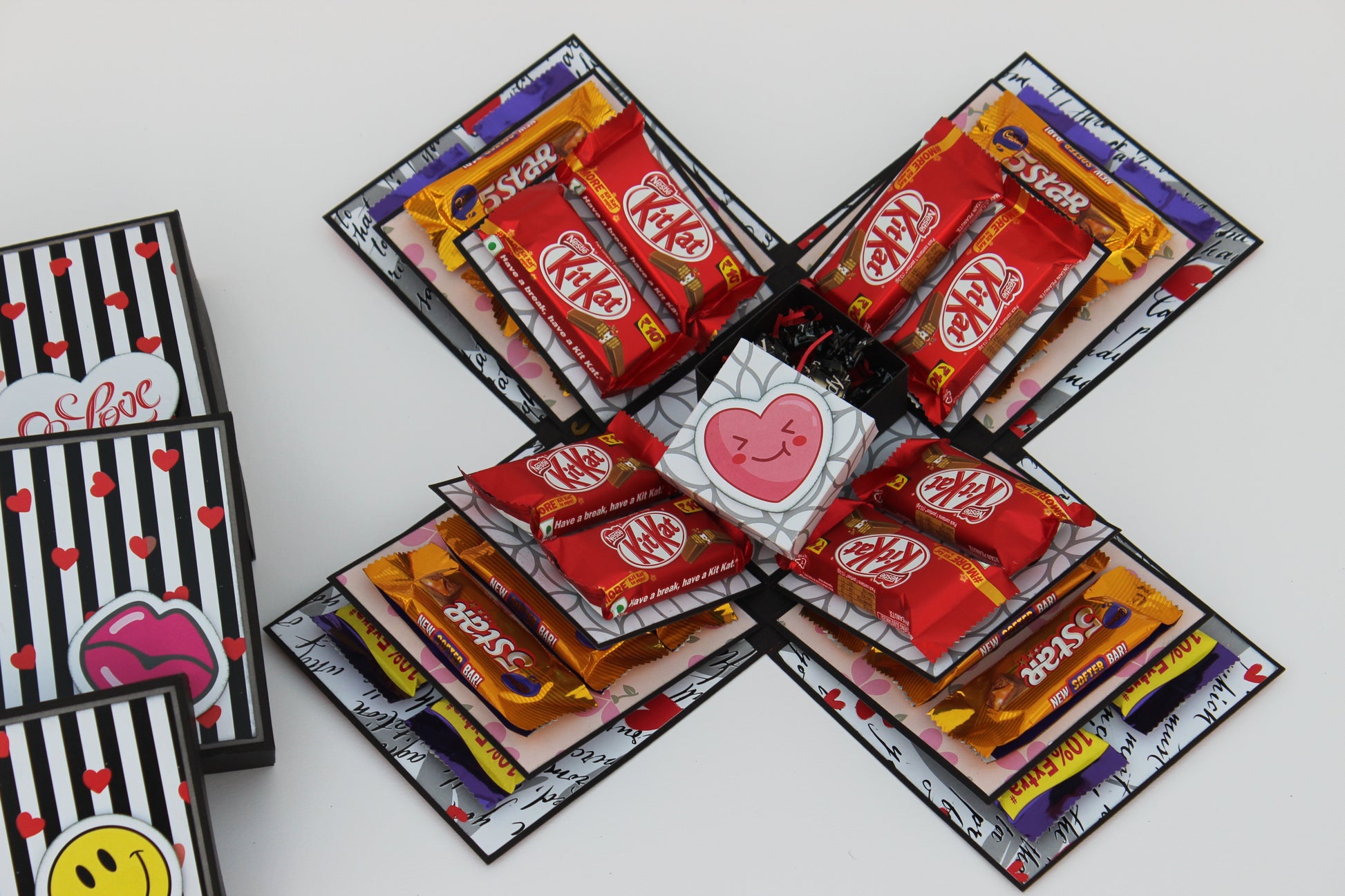 Chocolate explosion box fully opened with KitKat, 5 Star and Dairy Milk chocolates on all four sides
