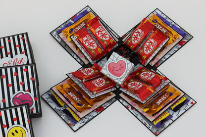 Chocolate explosion box fully opened with KitKat, 5 Star and Dairy Milk chocolates on all four sides