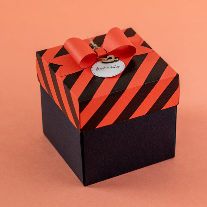 Explosion Box Red Luxe closed box with red striped lid and bow