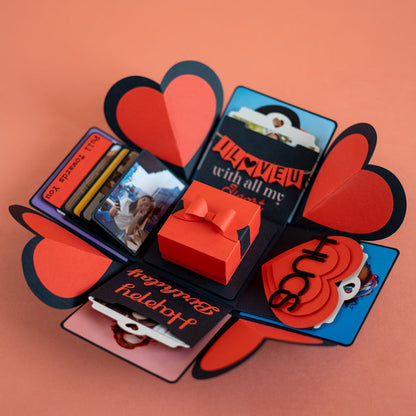 Explosion Box Red Luxe open with heart-shaped panels and photo sections